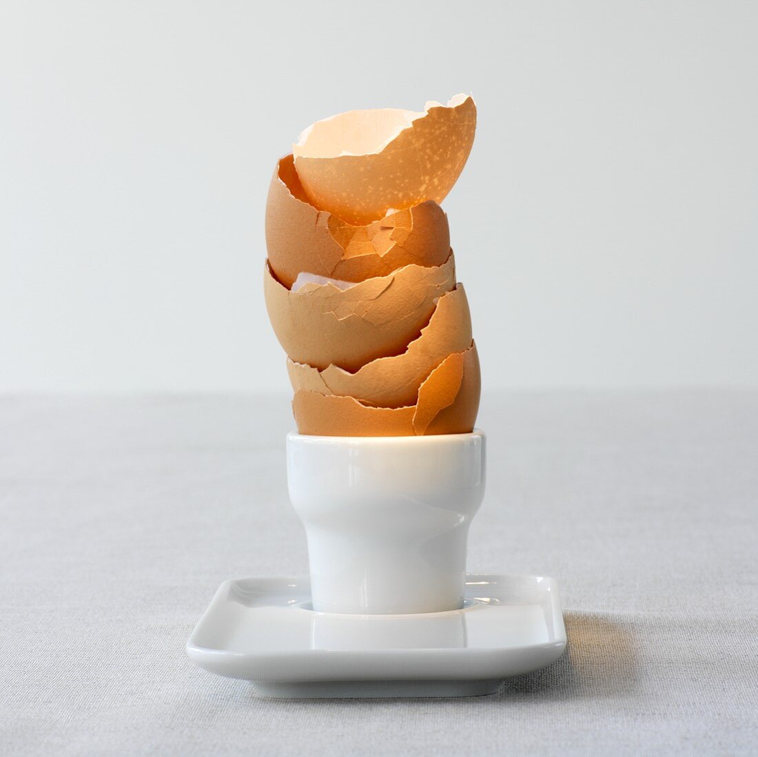 Egg shells stacked in an egg cup
