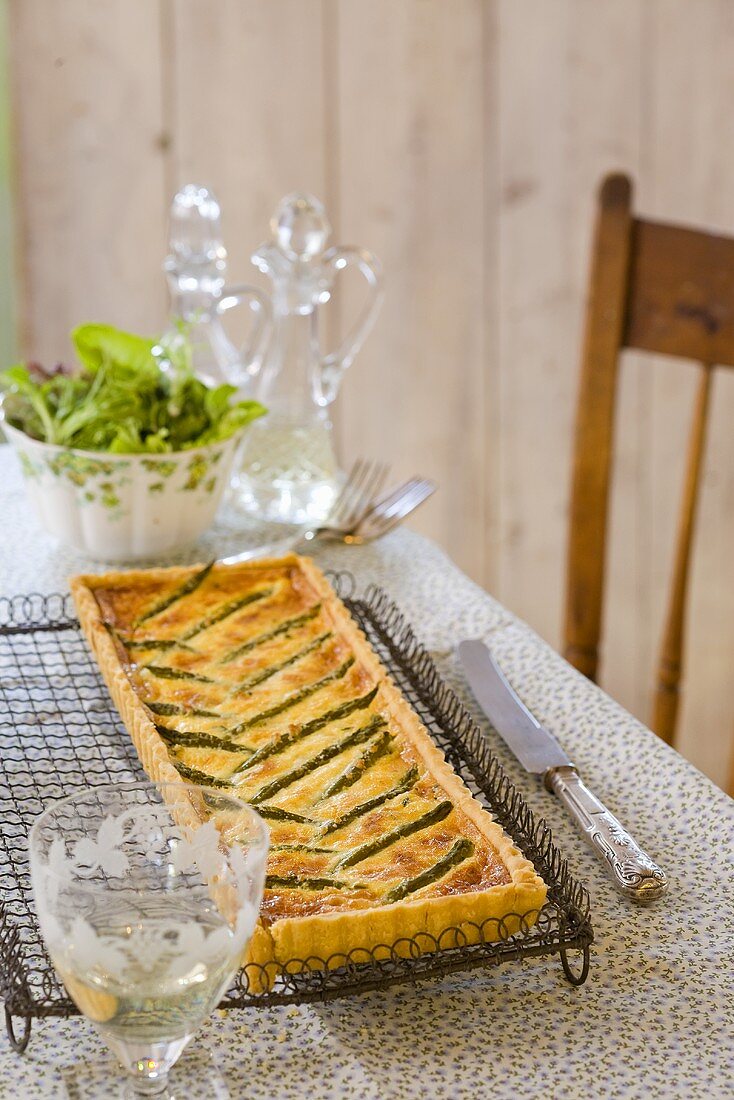 Asparagus quiche with parmesan on a table