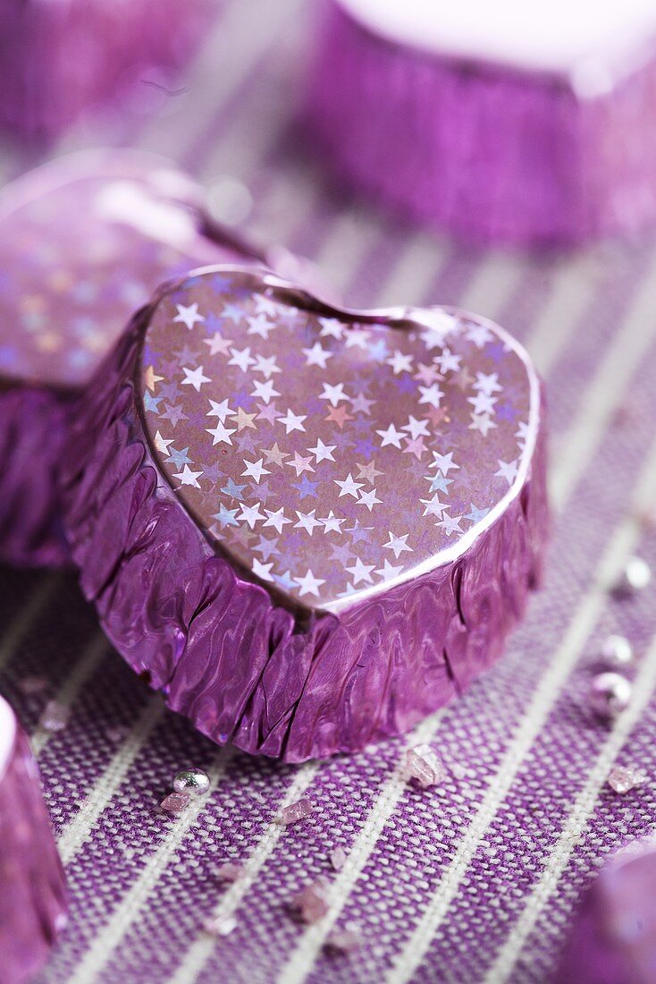 A purple-coloured, heart-shaped praline