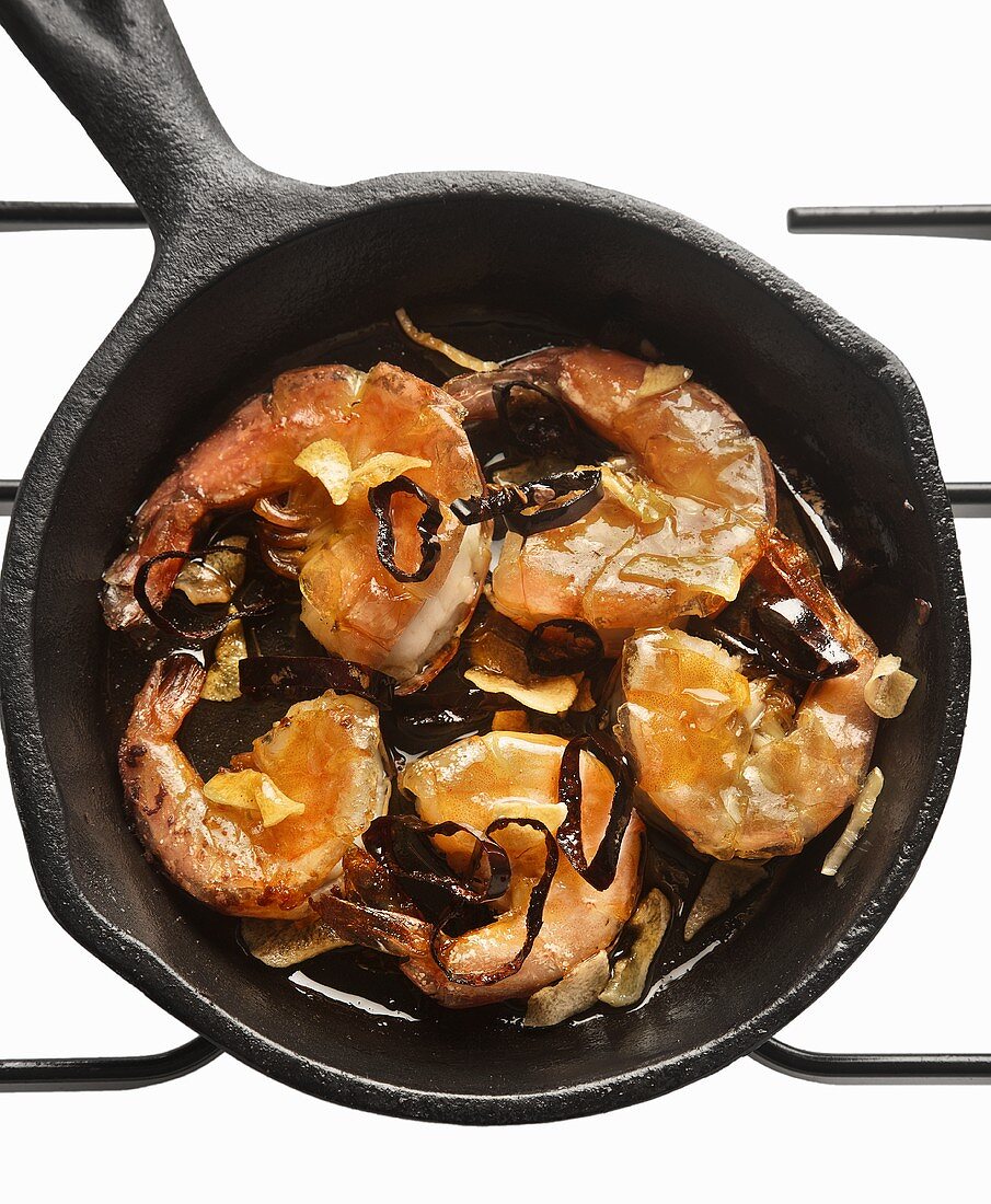 Shrimps with garlic and chilli in a cast iron pan