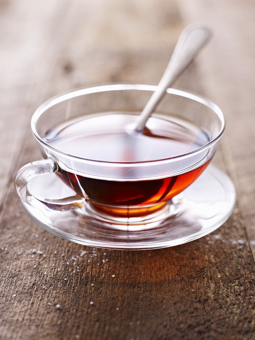 Tea in a glass cup and saucer