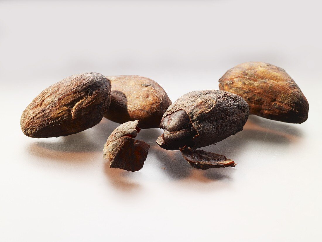 Four cocoa beans (close-up)