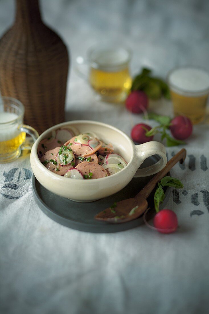 Sausage salad with radishes and onions