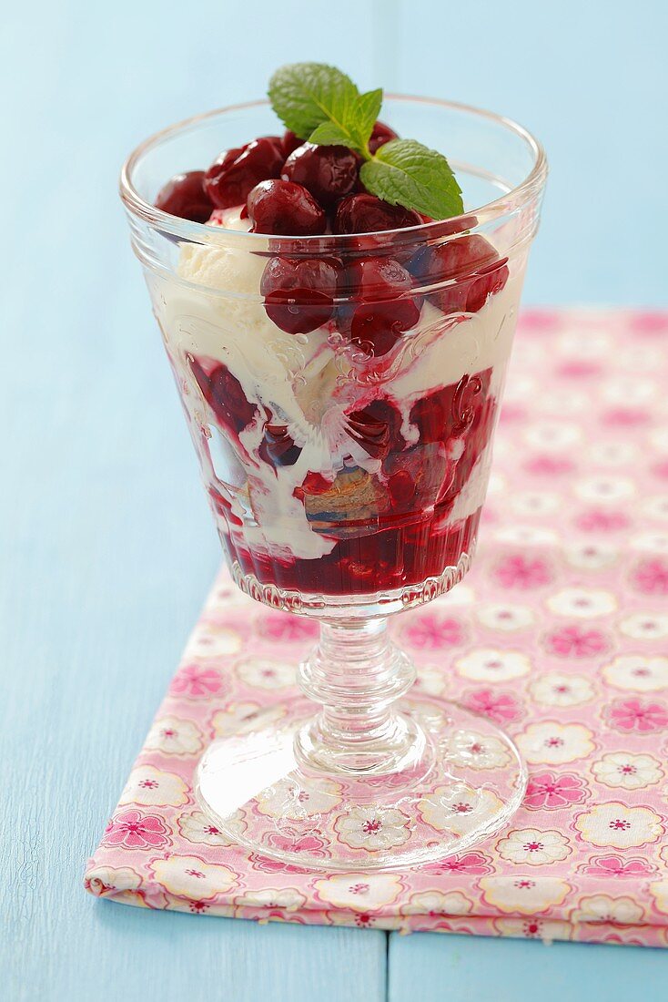 Layered dessert with amaretti, cherries and ice cream