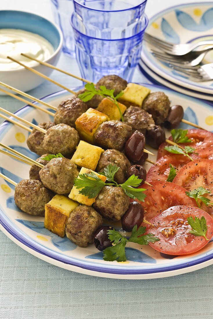 Meatball kebabs with haloumi and olives (Greece)