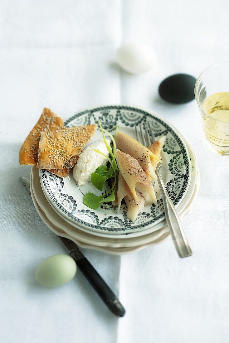 Smoked trout with creamy horseradish and crisp breads for Easter