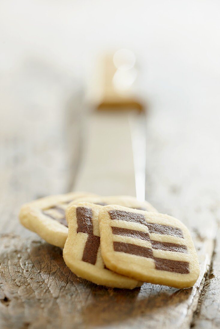 Black and white cookies on a knife