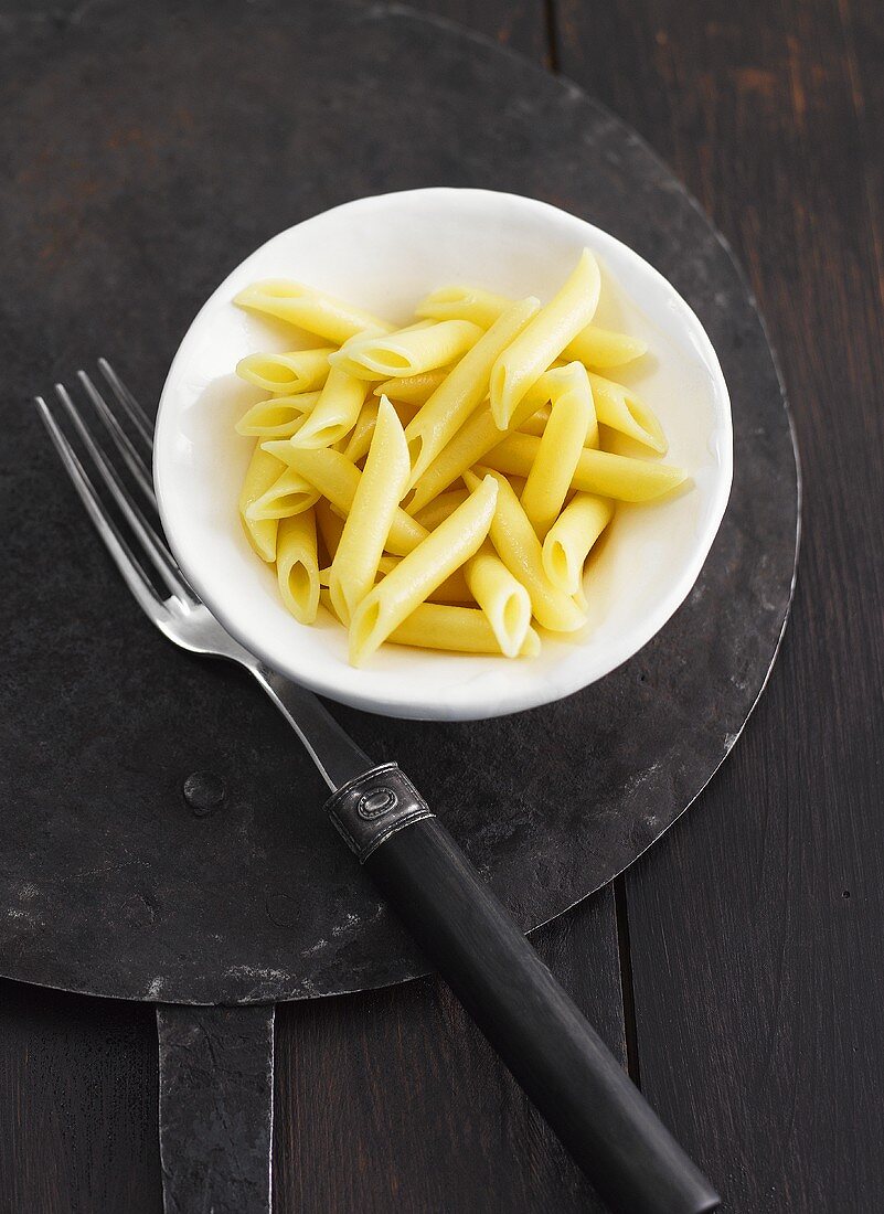 A plate of cooked penne