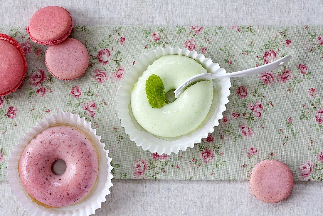 Strawberry cream and melon cream doughnuts with macaroons