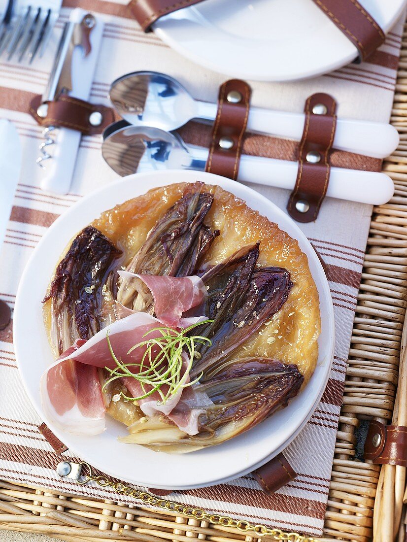 A puff pastry sandwich with chicory and pata negra ham