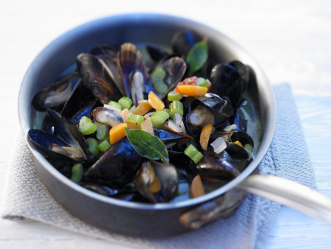 Spicy mussel soup in a pot