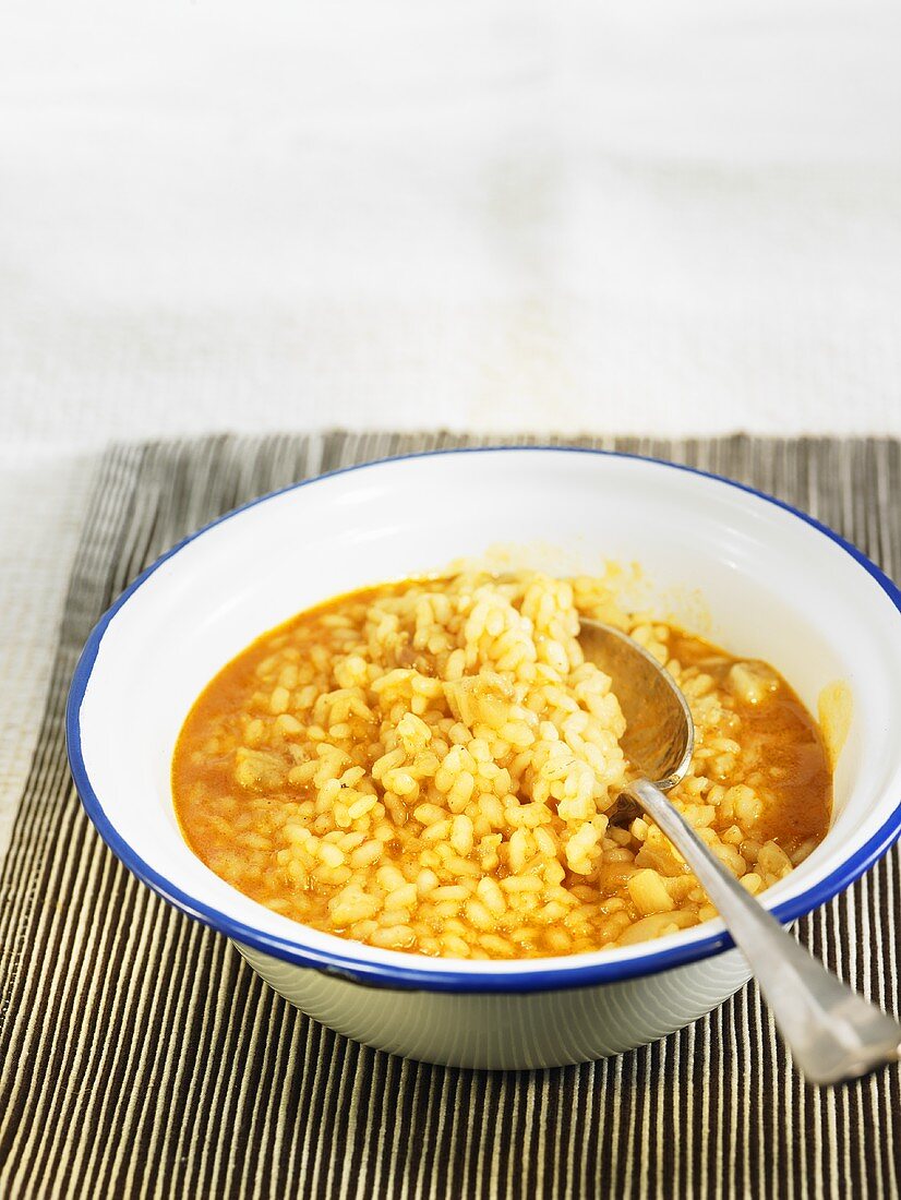 Arroz meloso (Spanish rice dish) with gold mackerel