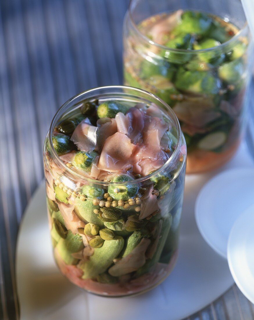 Spicy pickled vegetables in jars