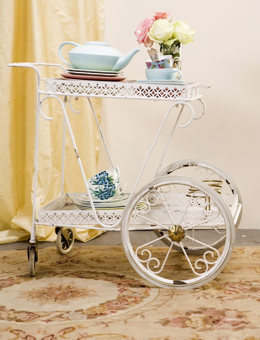 Place settings for tea on a tea trolley