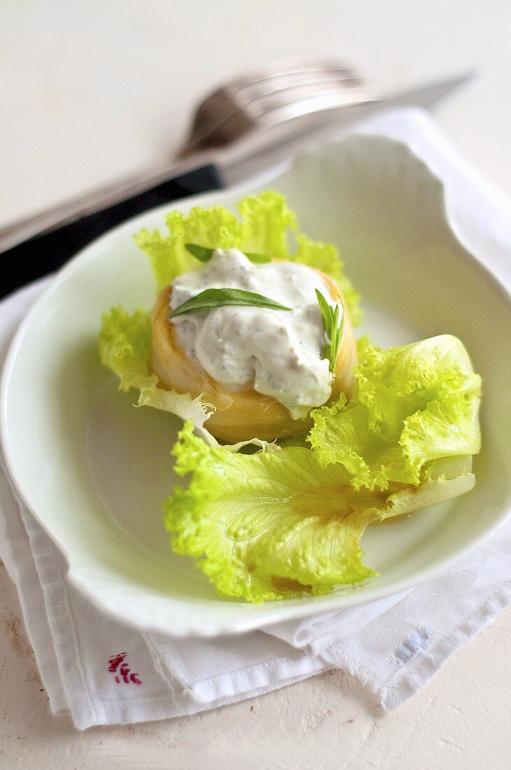 Artichoke hearts with cream cheese on lettuce leaves