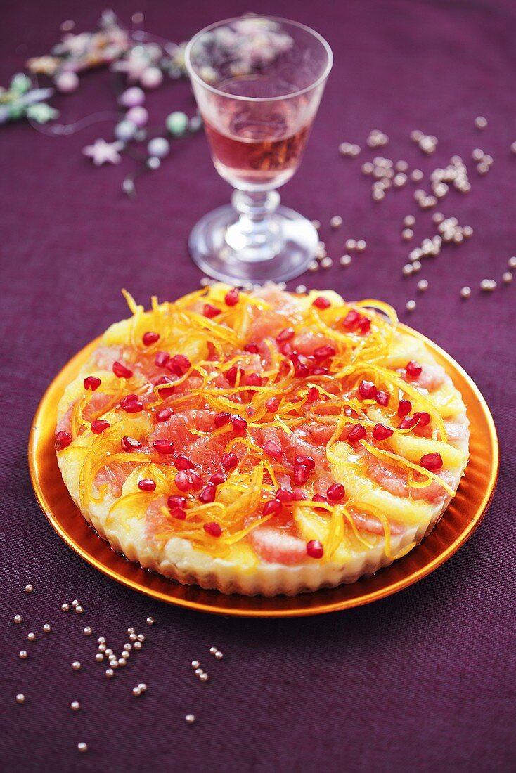 Citrus fruit tart with pomegranate seeds for Christmas dinner