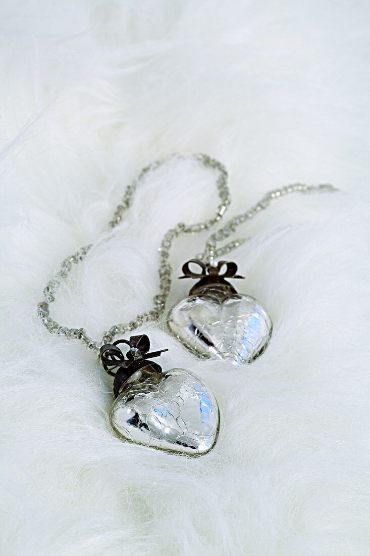 Silver hearts on a white fur