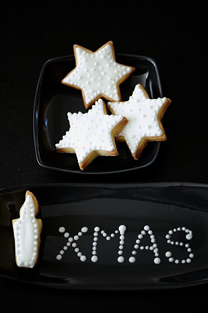 Shortbread biscuits (a star and a candle) with white icing