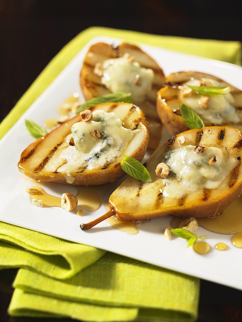 Grilled pears with blue cheese and nuts drizzled with honey