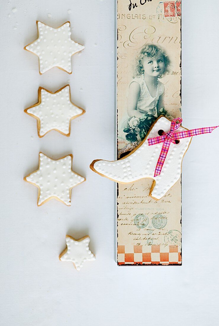 Shortbread biscuits with white icing and a nostalgic postcard