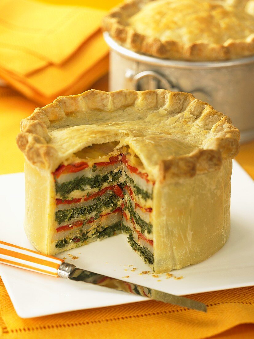A layered vegetable pie, sliced