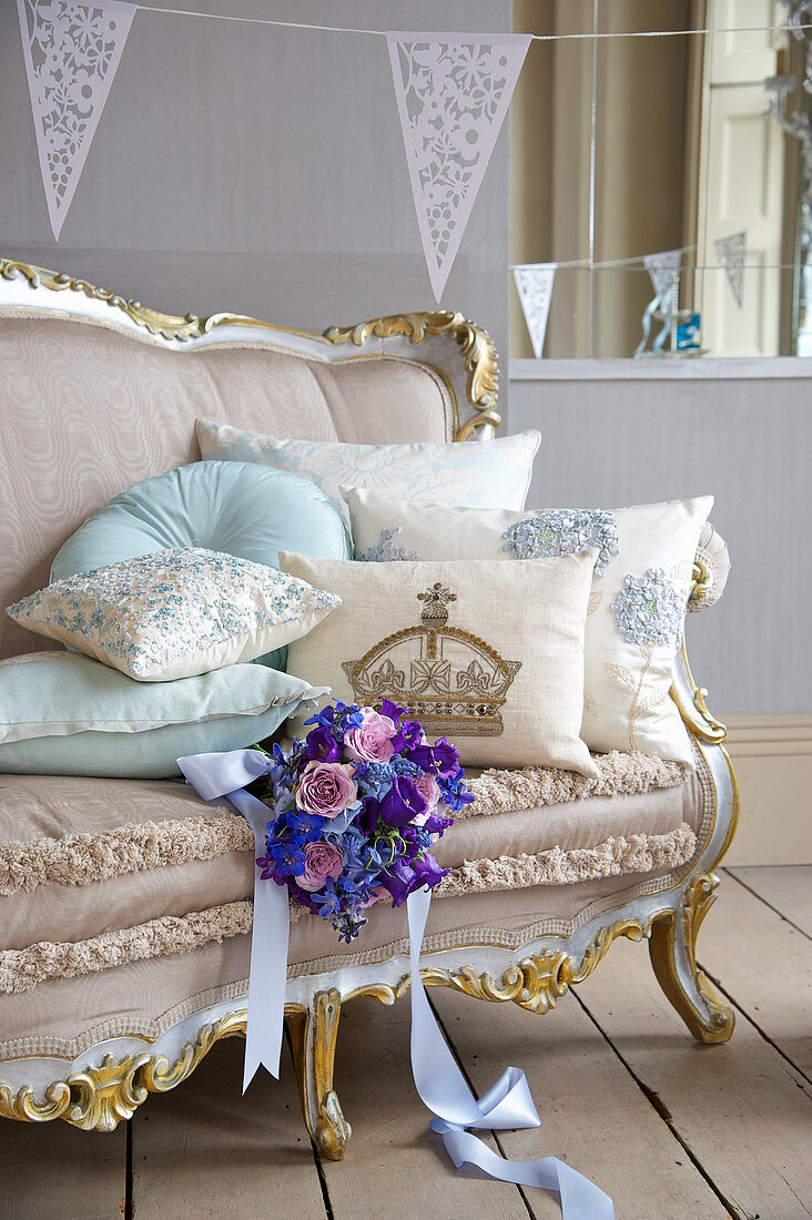 A bride's bouquet on an antique sofa