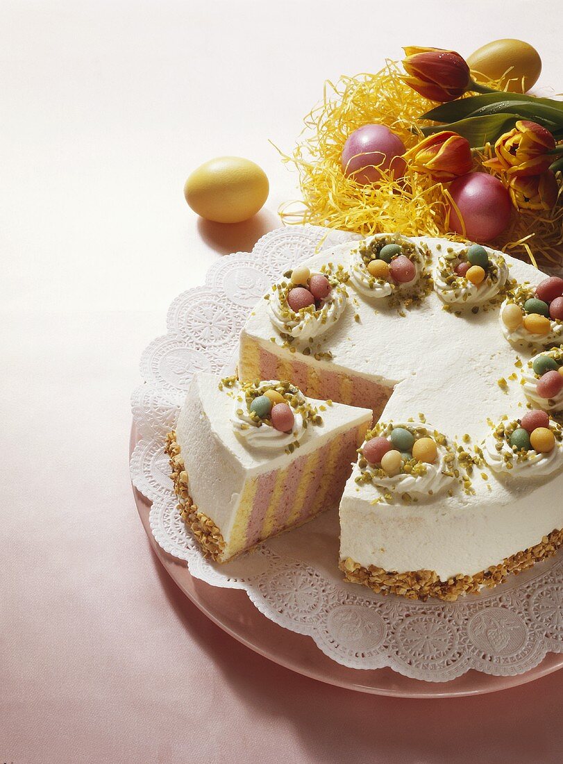 Colourful Easter cake decorated with marzipan eggs