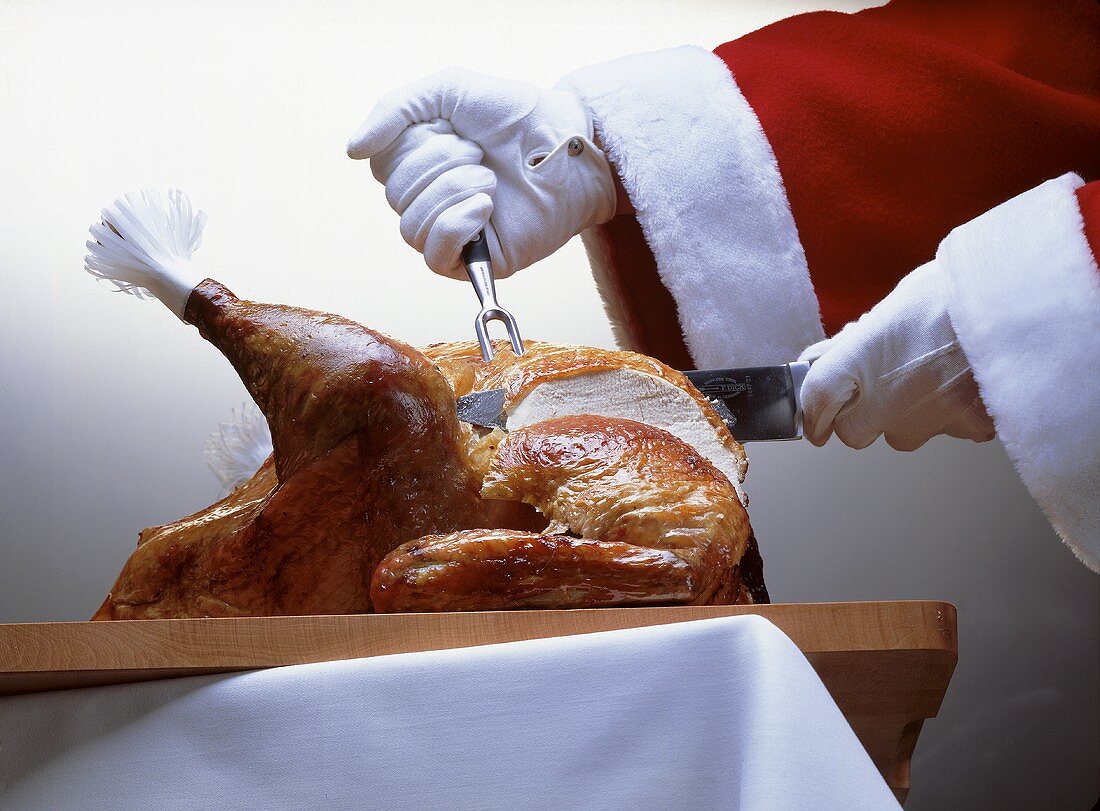 Santa carving the turkey
