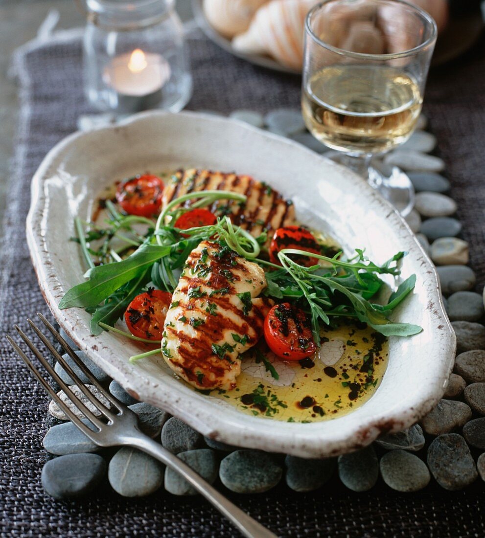 Grilled halloumi with wild rocket and tomatoes
