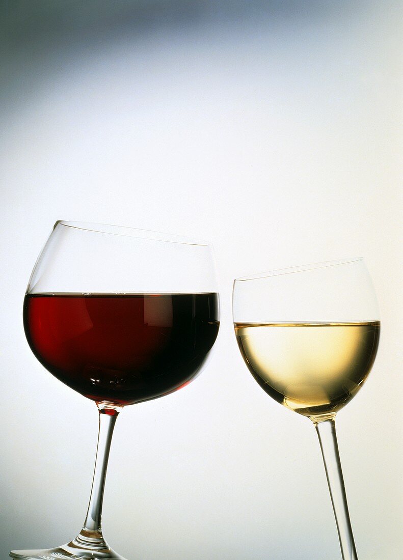 Chinking red and white wine glasses
