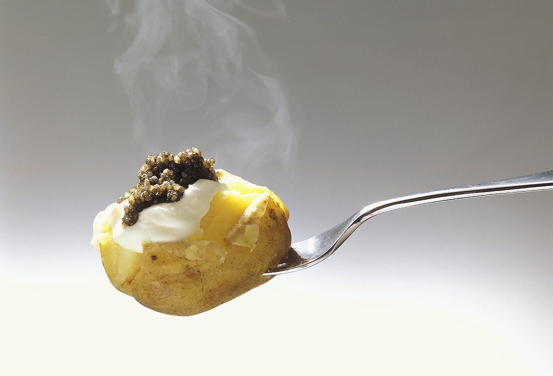 Potato in Skin topped with Sour Cream and Caviar