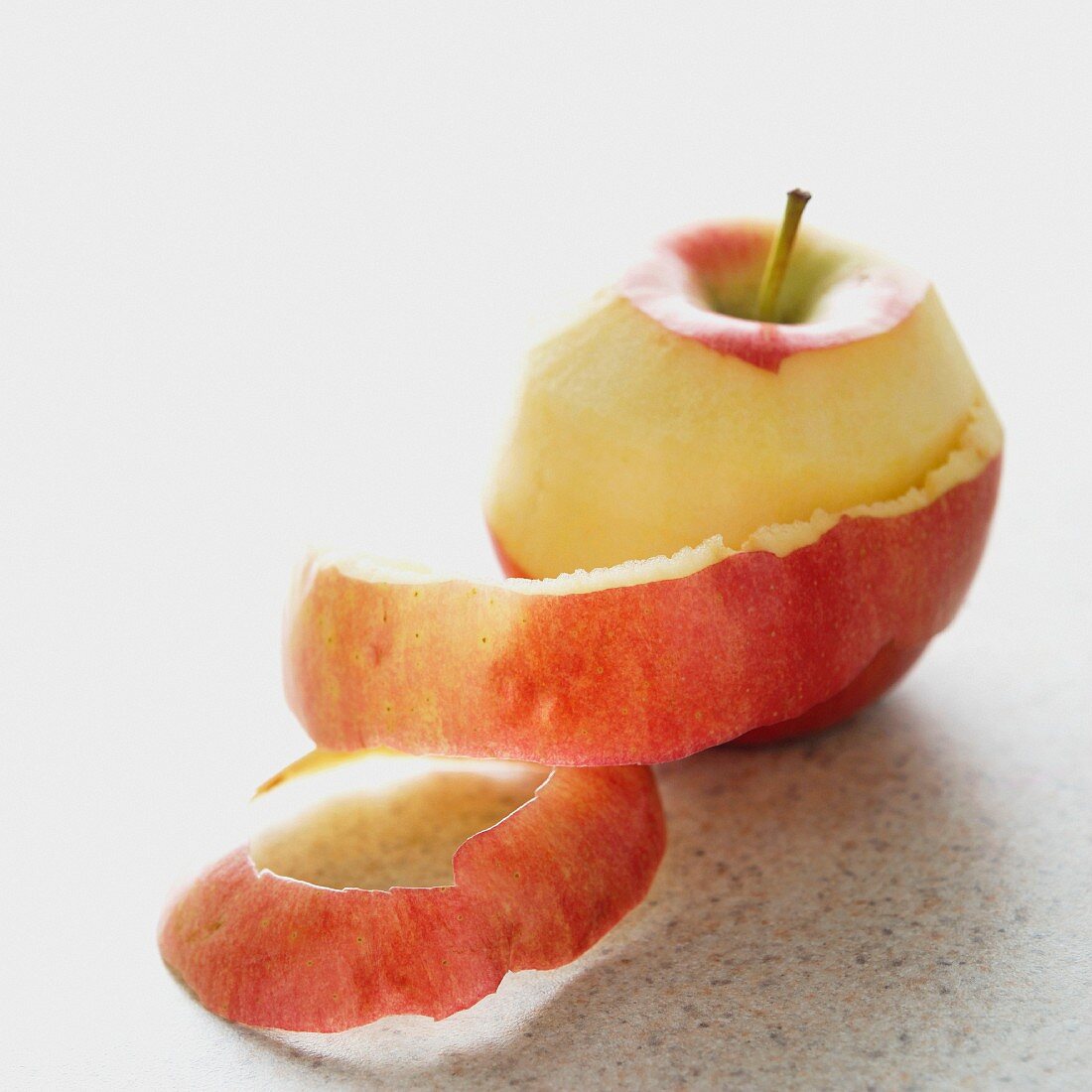 A half-peeled apple