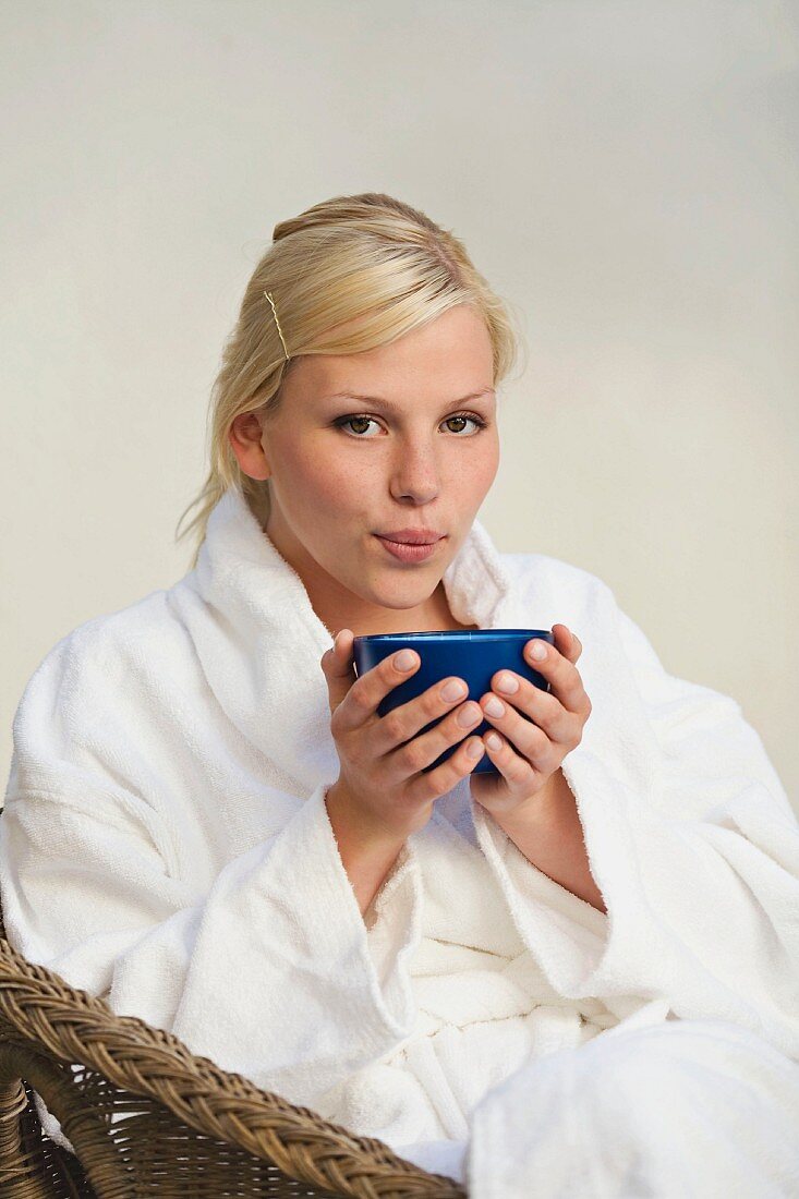 Young blond woman with a cup of tea