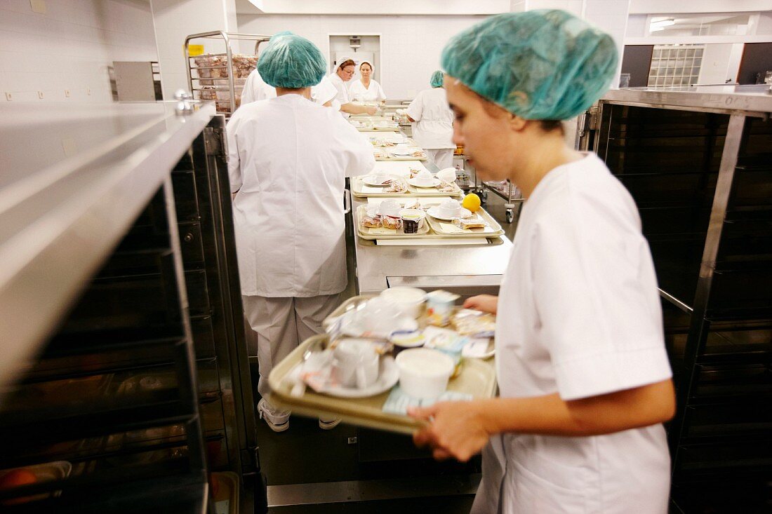 Trays of food being prepared in a commercial kitchen