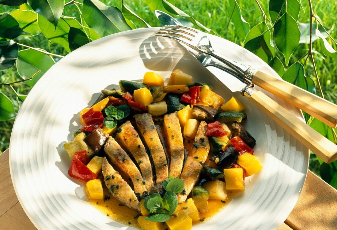 Thinly sliced veal,mango and mixed vegetable salad