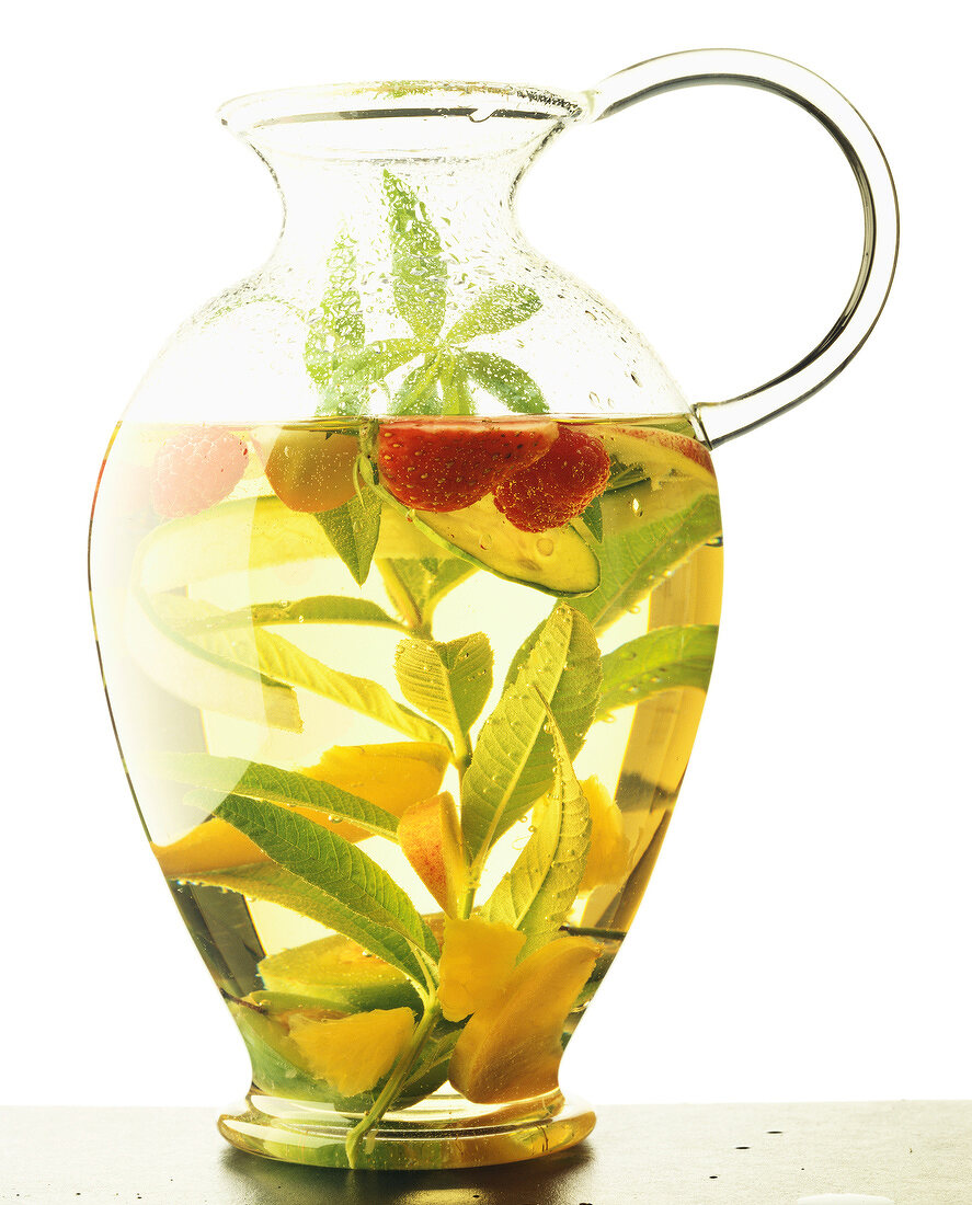 Jug of fruit macerated with herbs
