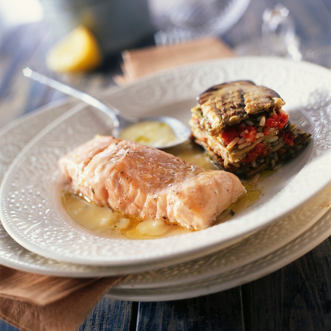 Roast salmon fillet with lemon sauce and eggplant mille-feuille