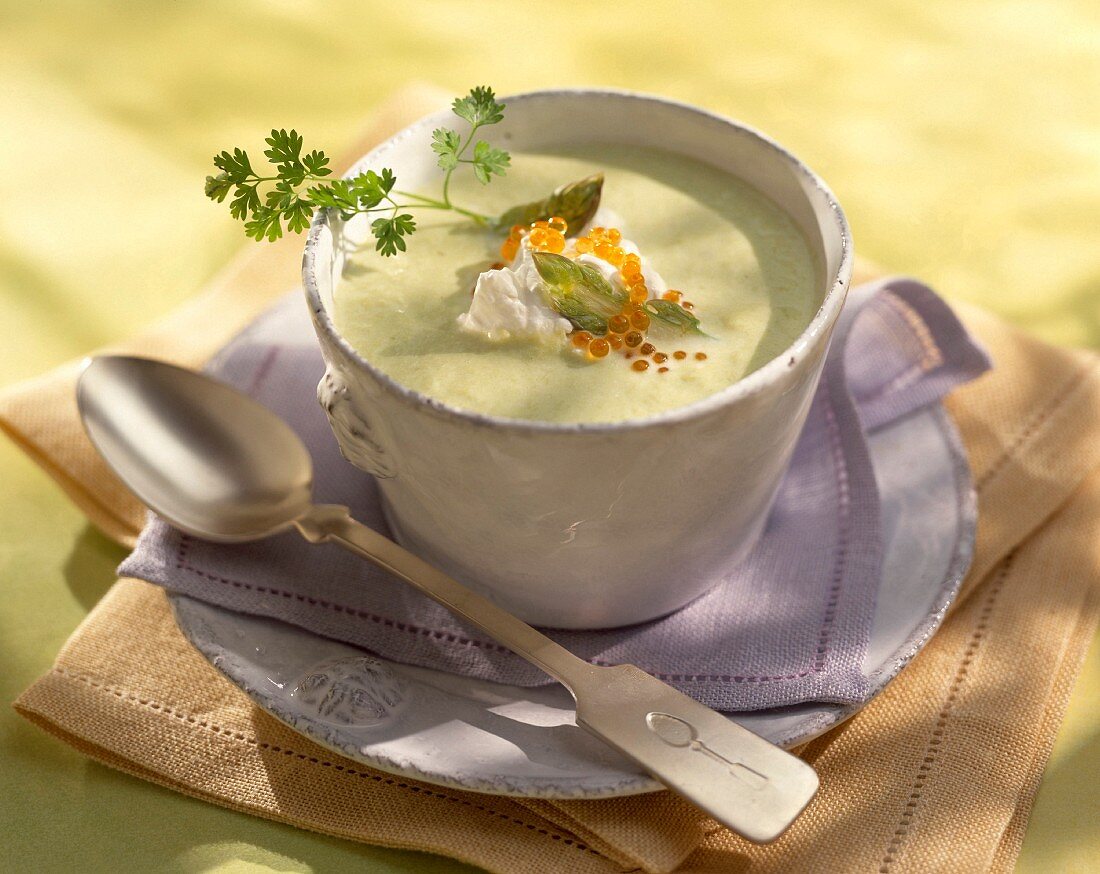 Creamed asparagus soup topped with cream