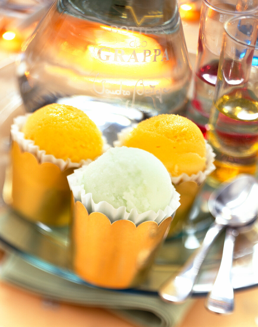 paper cups of sorbet with glass of grappa