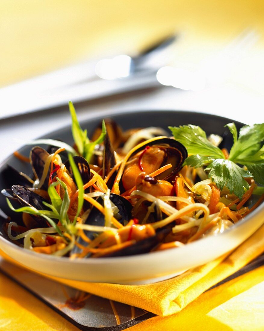 Mussels with saffron flavored baby vegetables