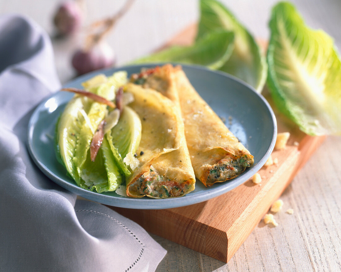 Pancakes with pesto, tomatoes and roast garlic