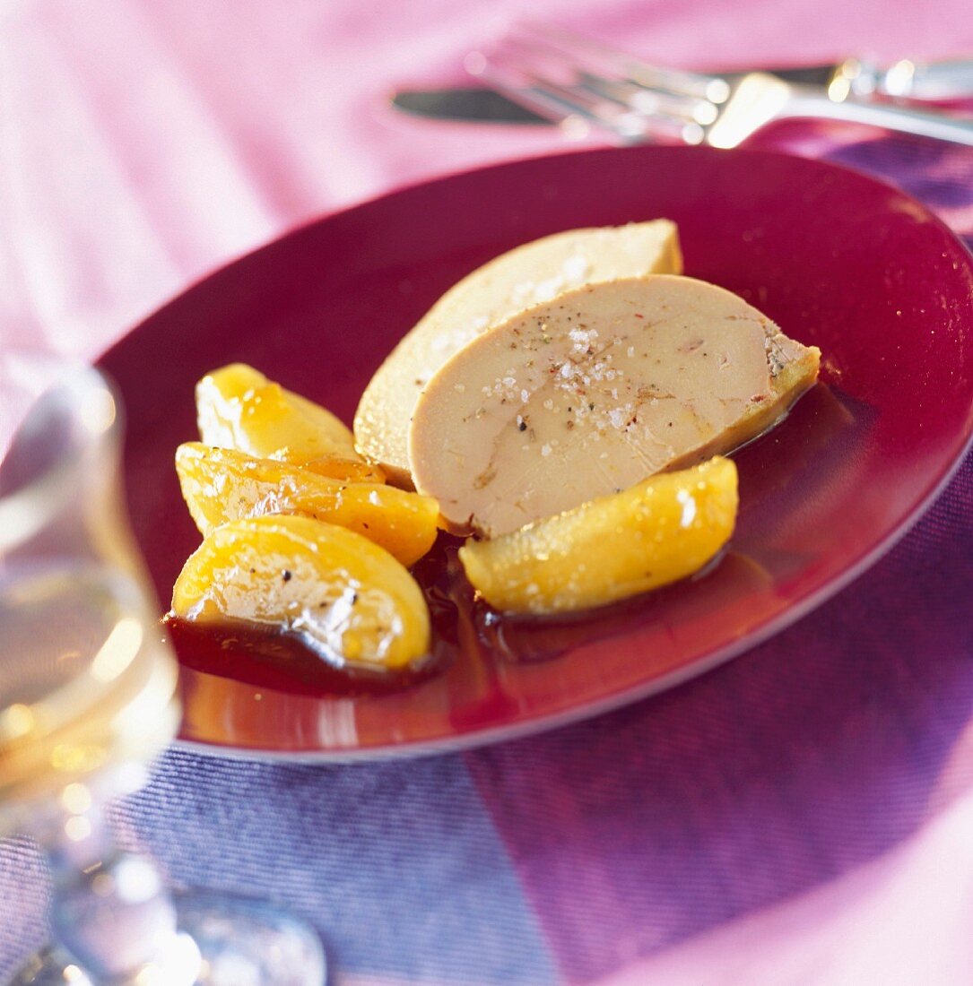 Slices of foie gras with caramelized peach