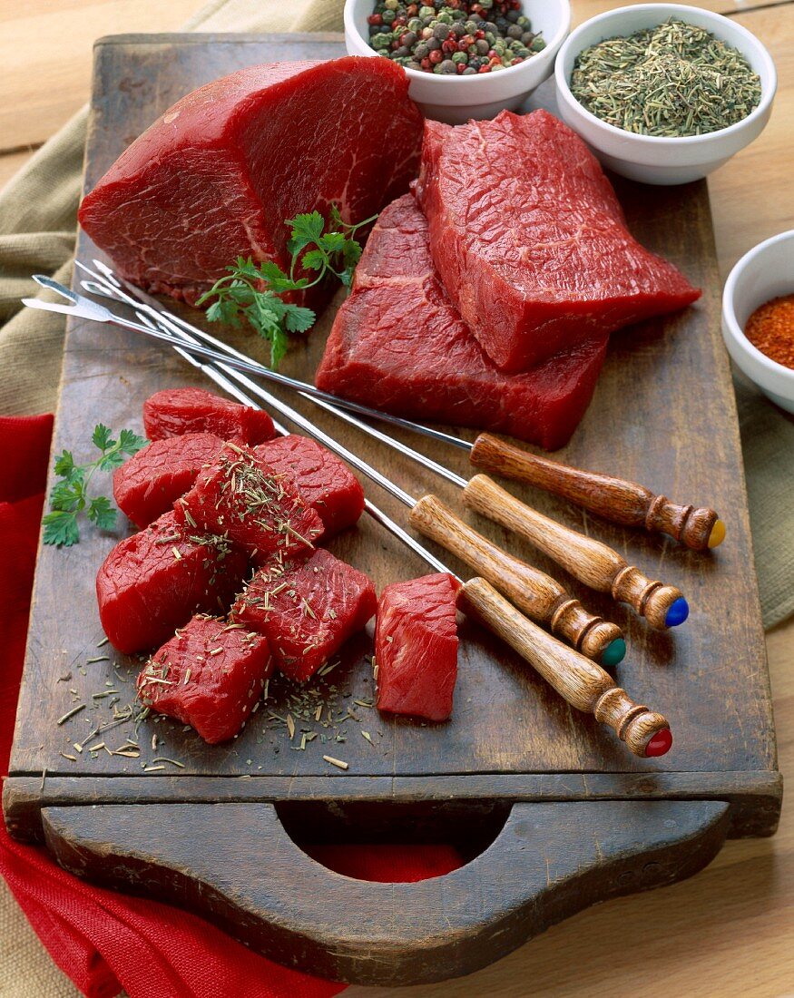 Chunks of raw beef for fondue on platter