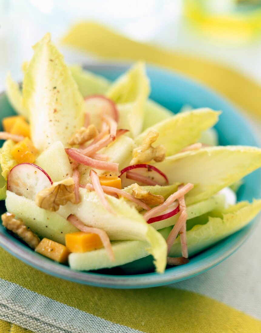 Chicory salad with grated ham and cheese