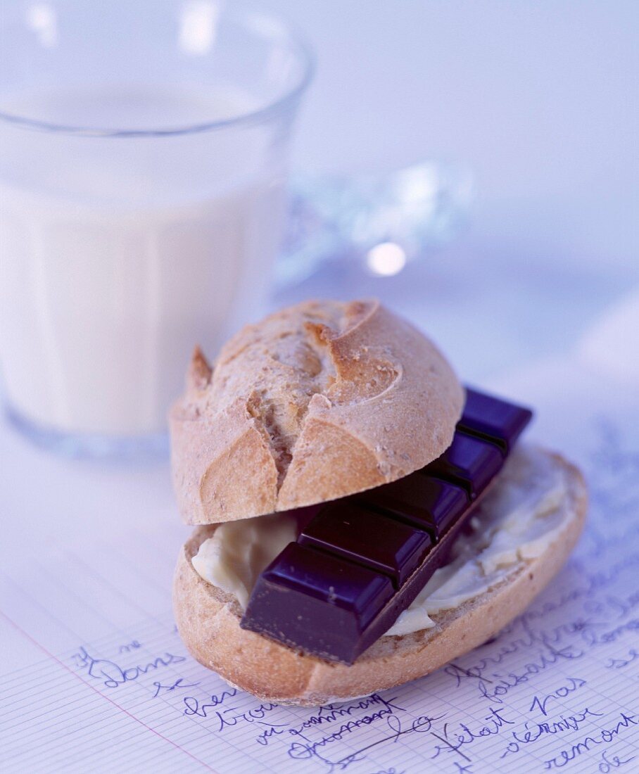 Bread and butter with a piece of dark chocolate