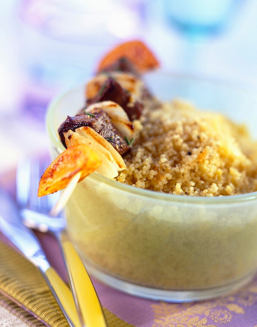 Lamb skewer and orange-flavored couscous