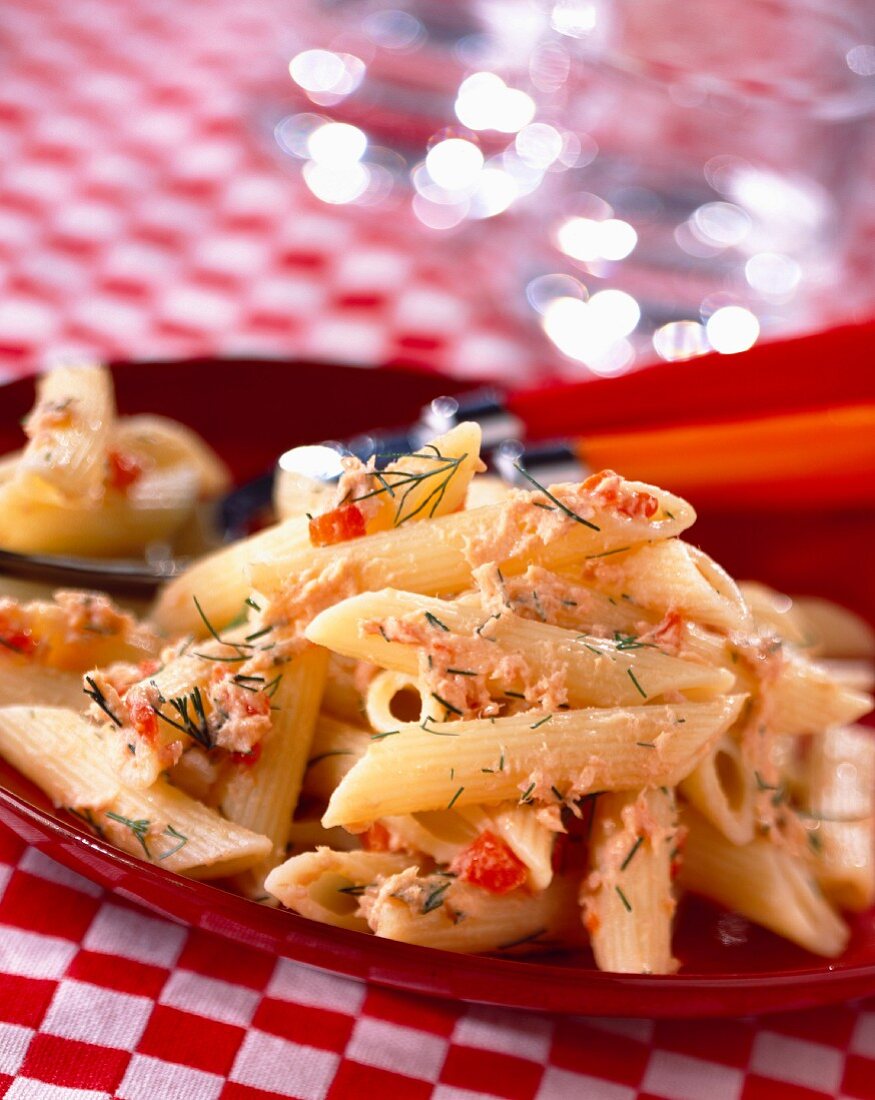 Penne pasta with potted fish