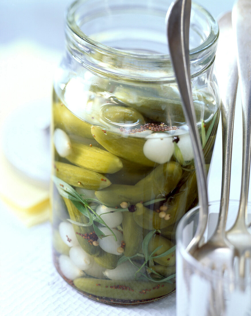 Gherkins and baby onions pickled in vinegar
