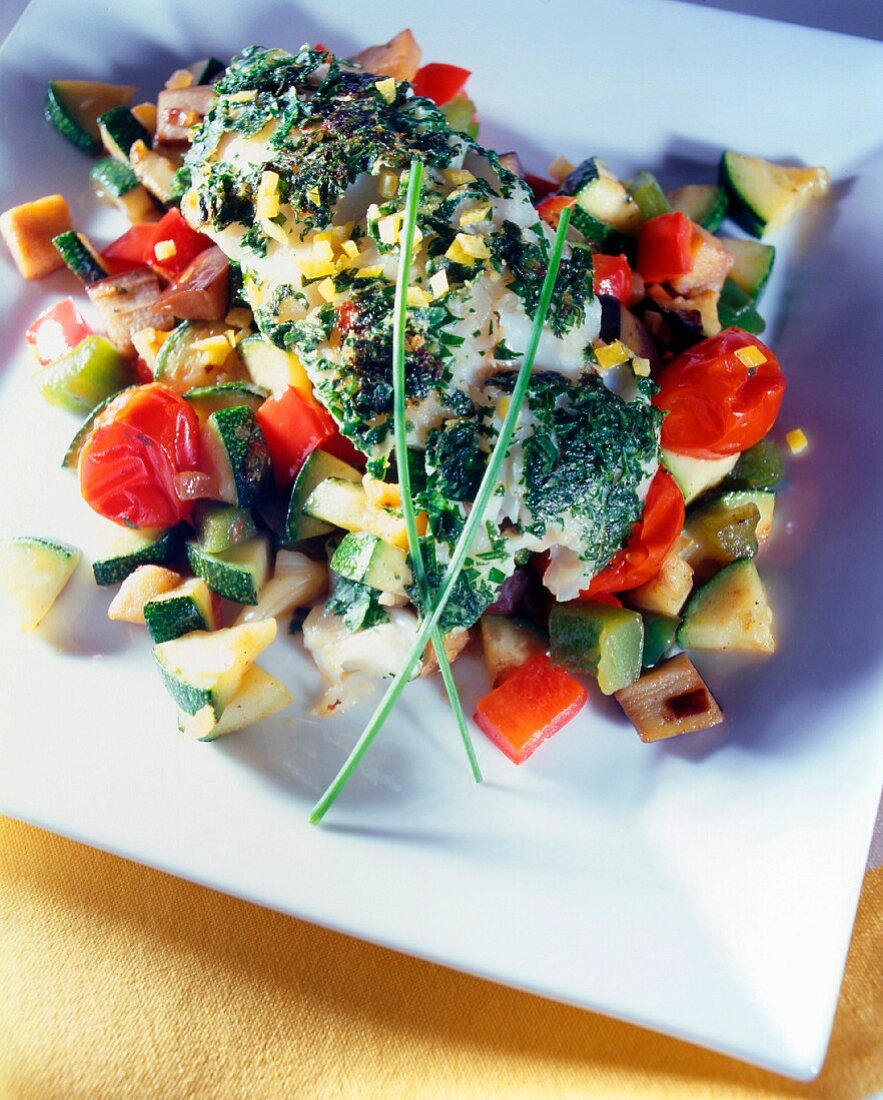 Cod steak with herbs and vegetables
