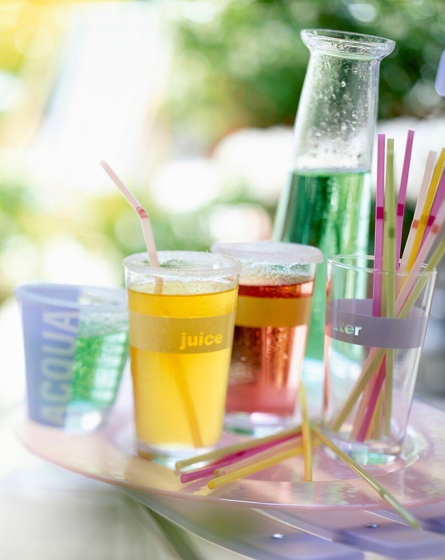glasses of cordial and straws
